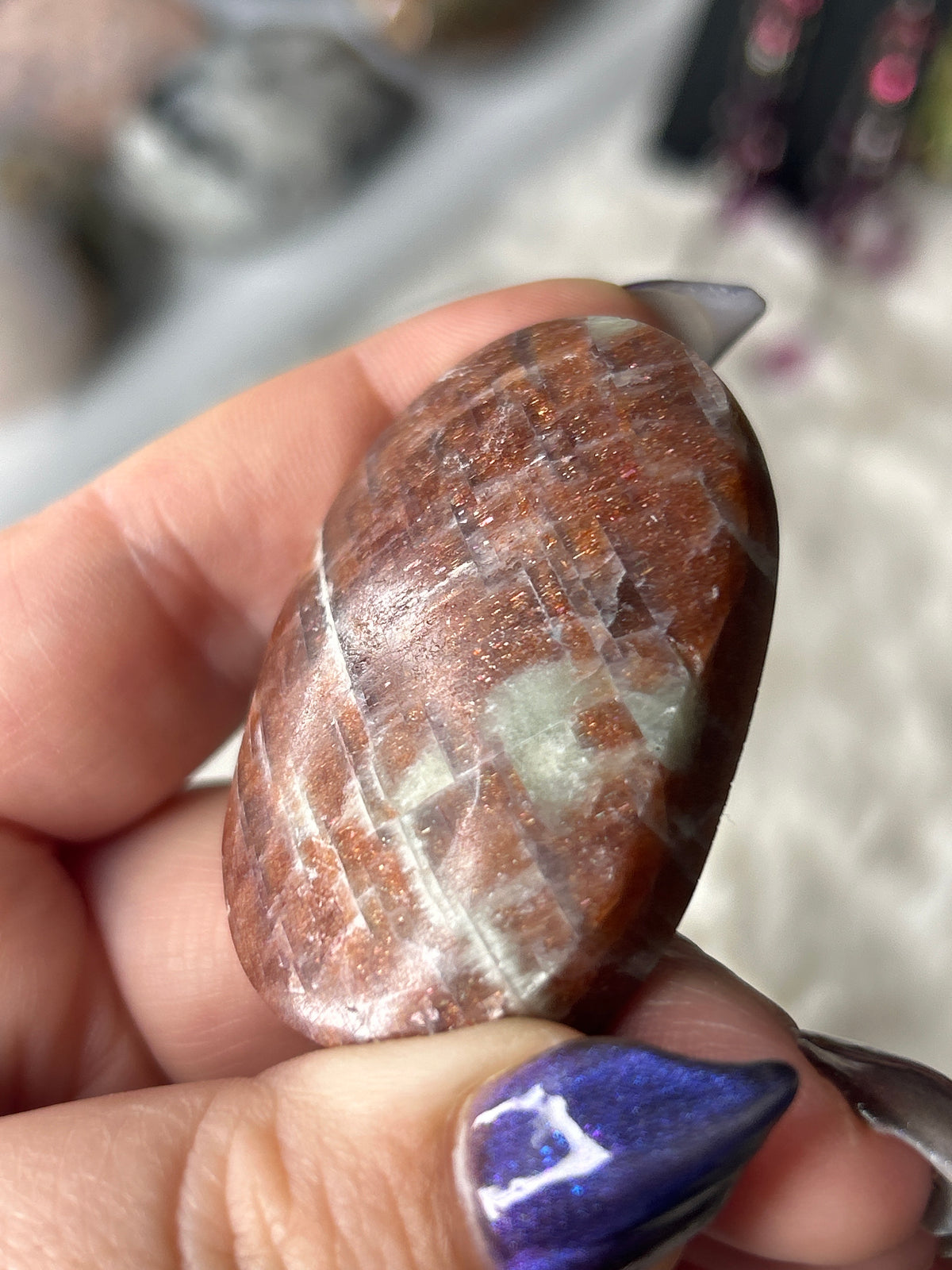 Iolite in Sunstone Palm Stone