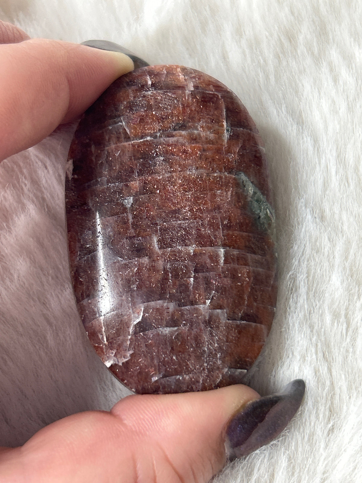Iolite in Sunstone Palm Stone