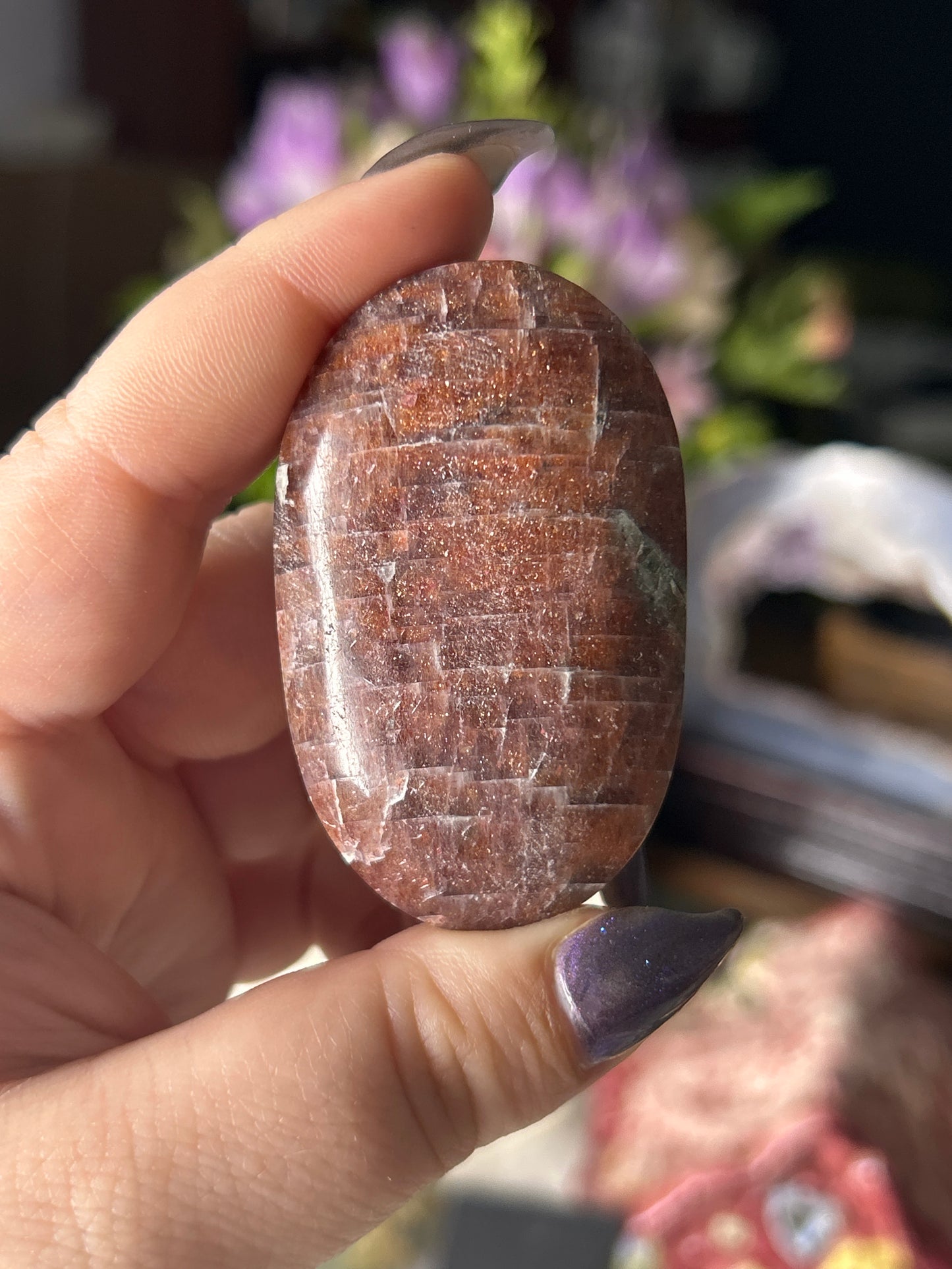 Iolite in Sunstone Palm Stone