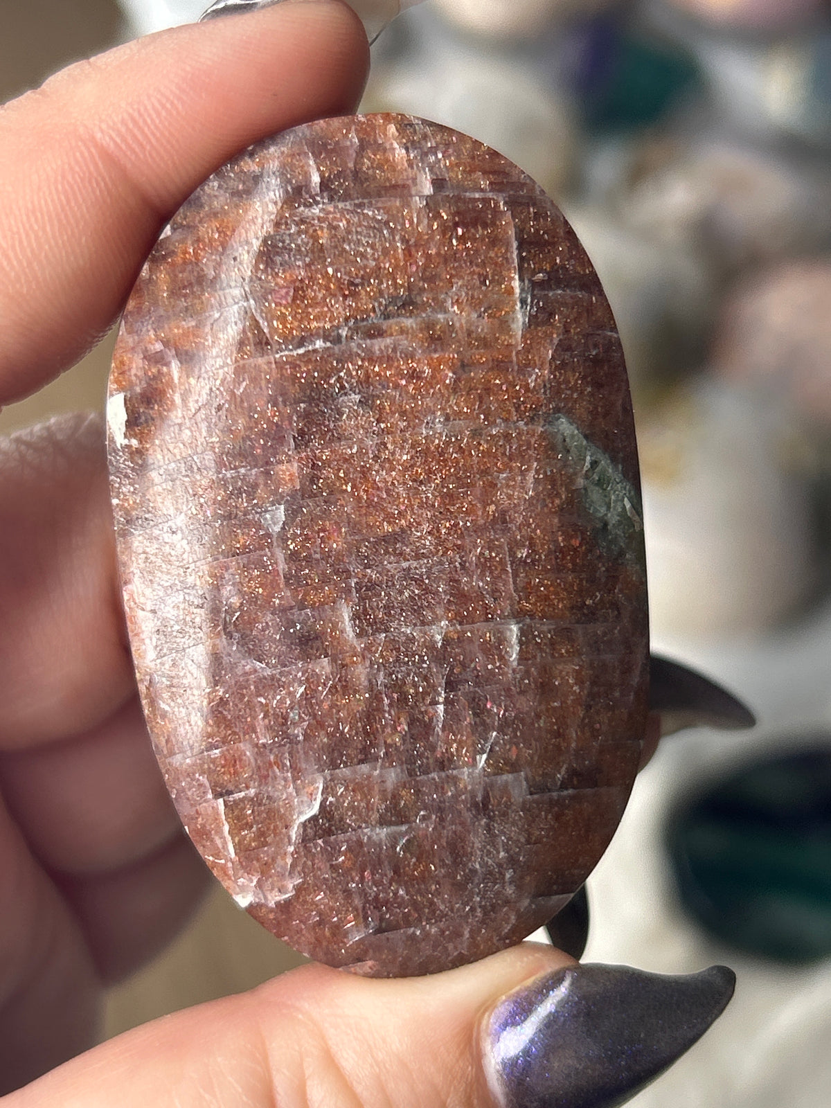 Iolite in Sunstone Palm Stone