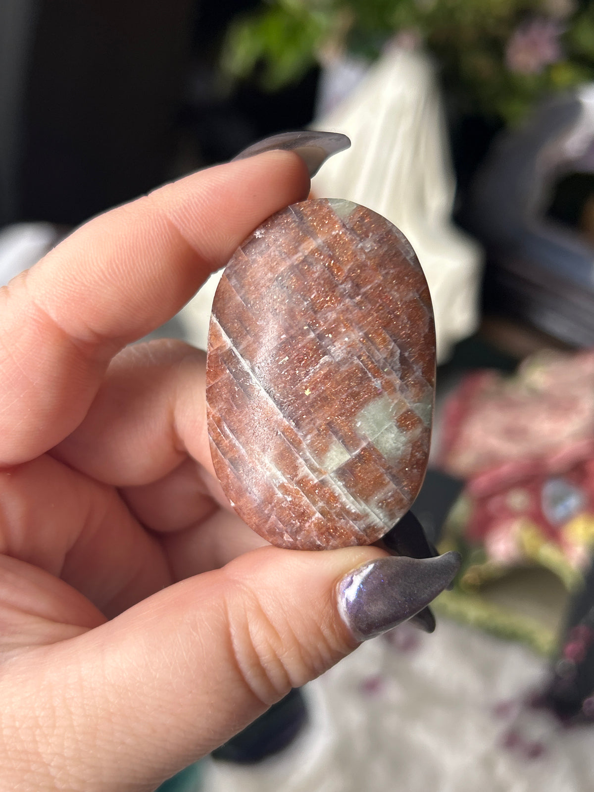 Iolite in Sunstone Palm Stone