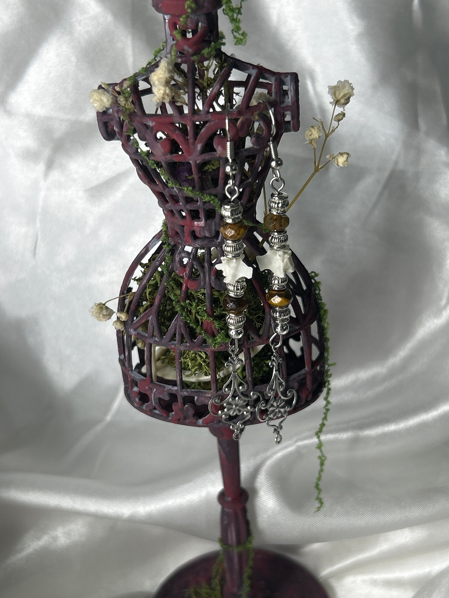 Ornate Dress Form Earring Display Featuring Mink Bones and Botanicals
